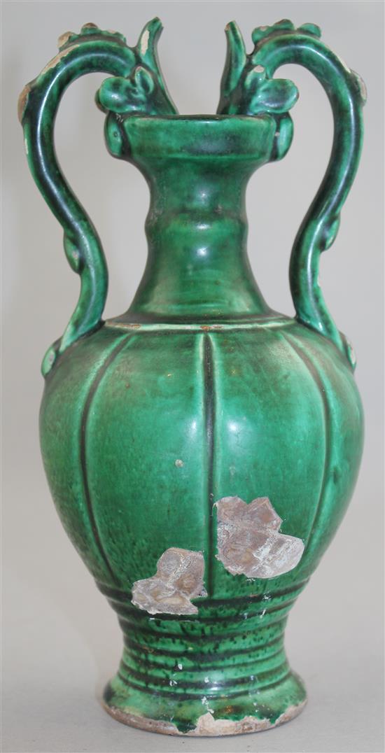 A Chinese green glazed pottery twin handled vase, in Tang style, 20.5cm.